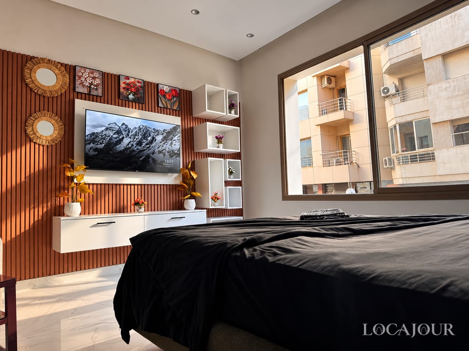 Luxury bedroom in Agdal Rabat furnished studio with modern decor large bed and natural light
