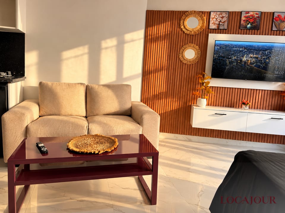 Modern living room in Agdal Rabat luxury furnished studio with Smart TV comfortable seating and stylish decorr