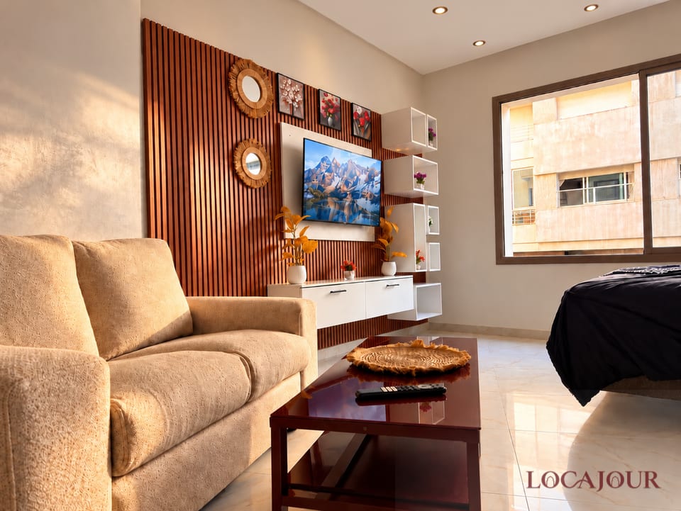 Bright living room in Agdal Rabat luxury furnished studio with sofa Smart TV modern decor and natural light