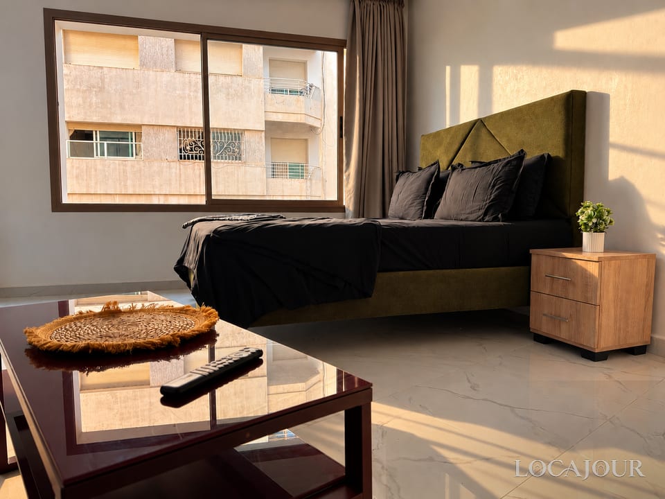 Luxury bedroom in Agdal Rabat furnished studio with comfortable bed large window modern decor and natural light